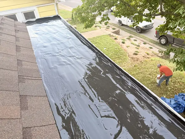 Box gutter lined with a new waterproof membrane along the roof edge