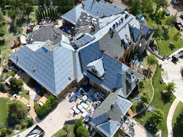 Complex roof covered in synthetic underlayment before shingles are installed